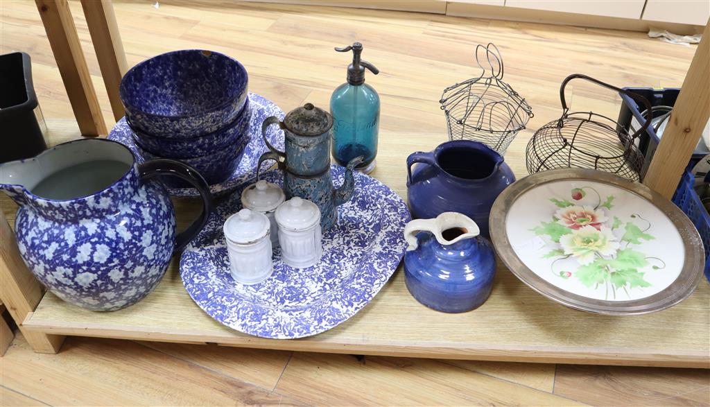 A collection of kitchenwares including a large ironstone jug, 26cm, spongeware bowls, platter, enamel cafeterie, storage jars, cake sta